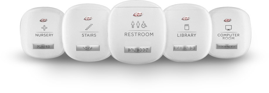 A row of nursery, stairs, restroom, library, and computer room braille signs using Clean Braille
